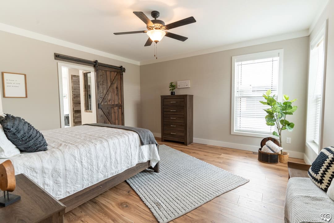 The barndominium bedroom home features